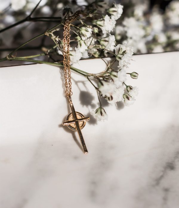 delicate gold cross